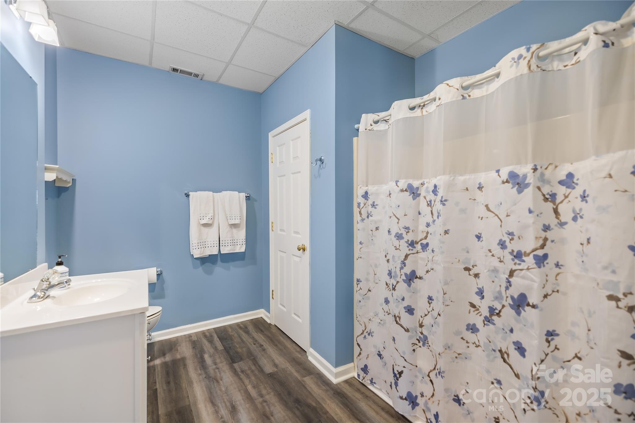 17112 Cambridge Grove Drive Huntersville, NC 28078 - Photo 32 of 44 a bathroom with a sink and a mirror