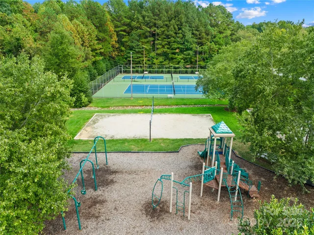 a view of a chairs and table in patio