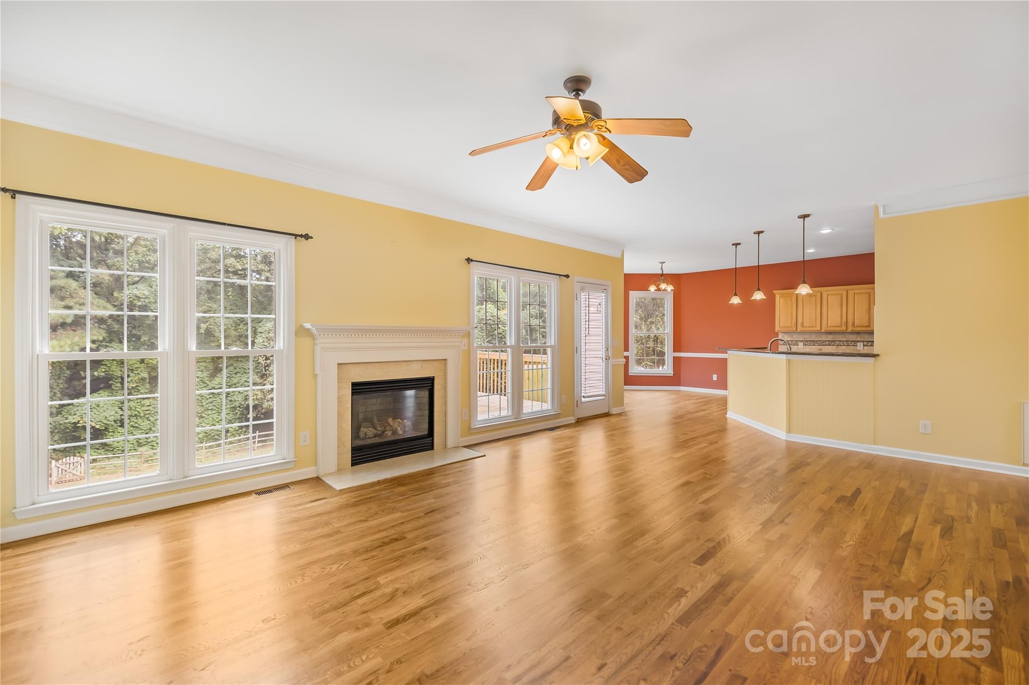 17112 Cambridge Grove Drive Huntersville, NC 28078 - Photo 8 of 44 a view of an empty room with a window and wooden floor