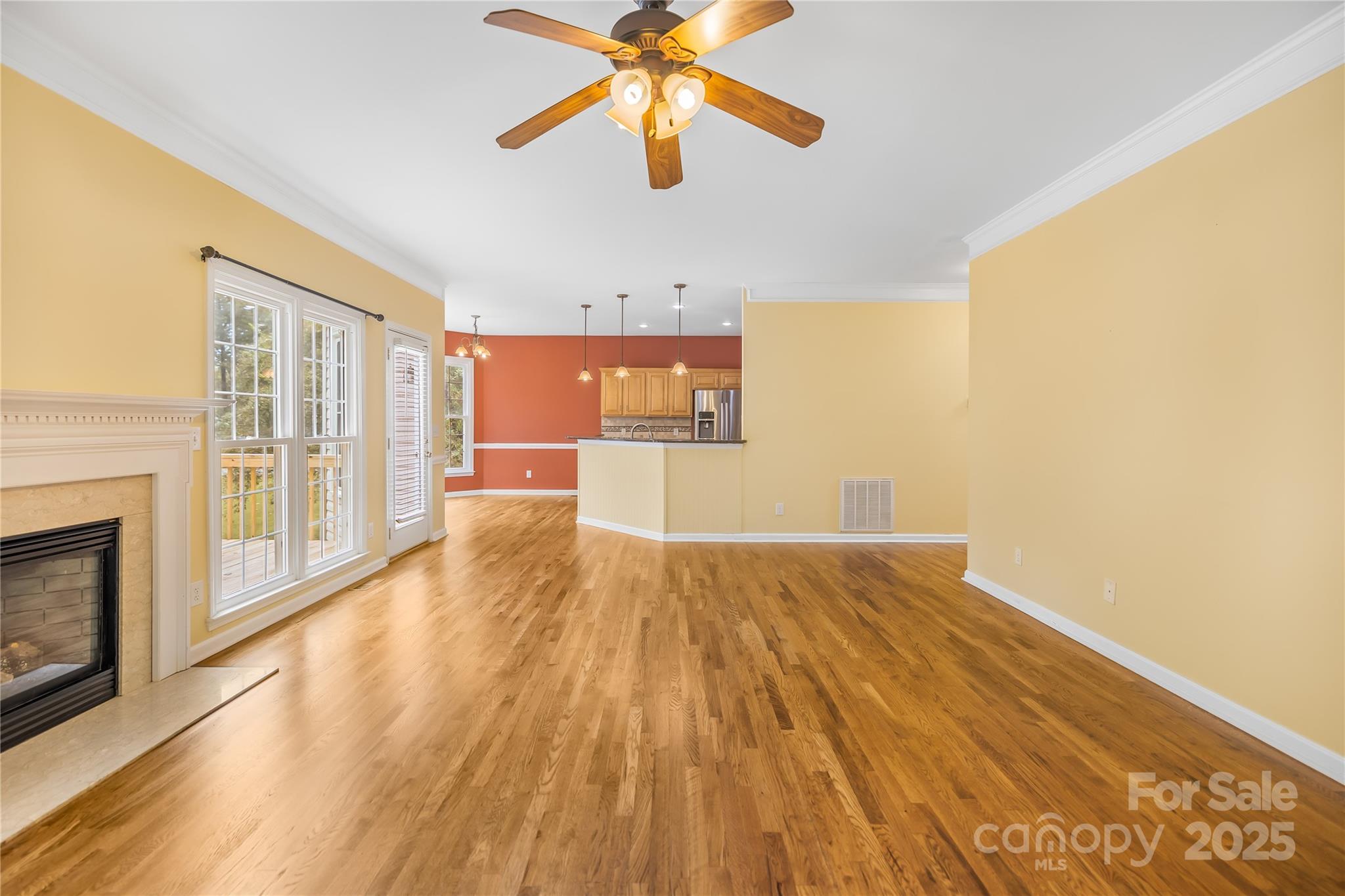 17112 Cambridge Grove Drive Huntersville, NC 28078 - Photo 9 of 44 a view of empty room with wooden floor and fan