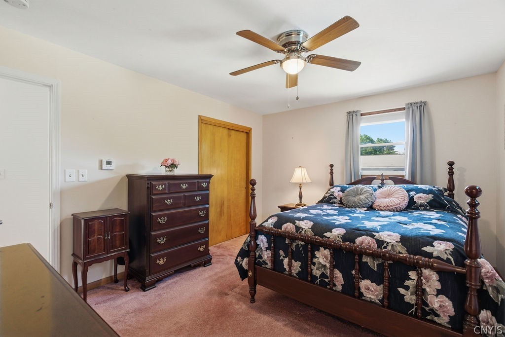 7454 Thunderbird Road Clay, NY 13088 - Photo 32 of 48 Primary Suite. (Hardwood floors under carpets.)