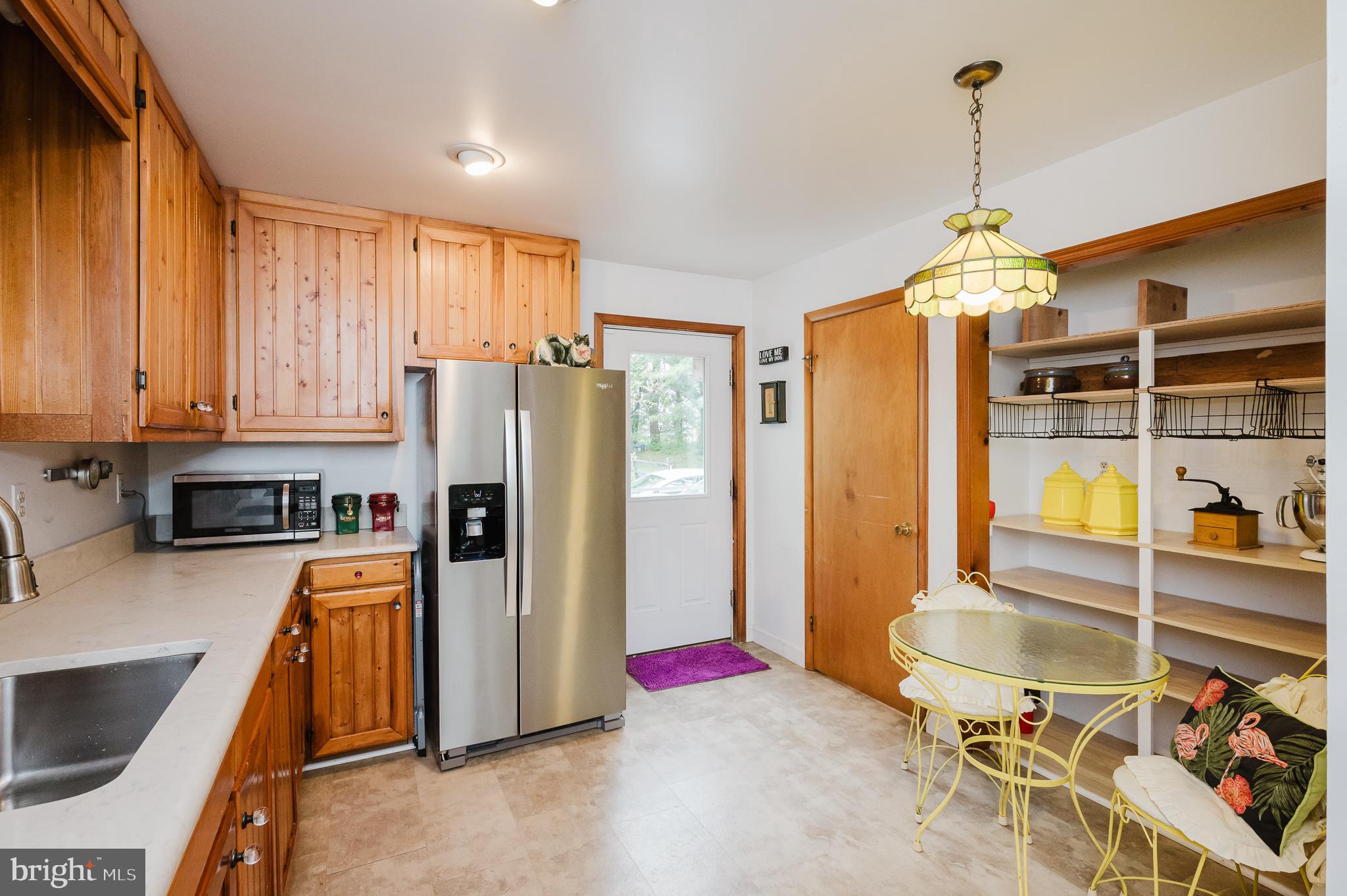 710 Magnolia Road Joppa, MD 21085 - Photo 9 of 58 a kitchen with stainless steel appliances granite countertop a refrigerator and a stove top oven