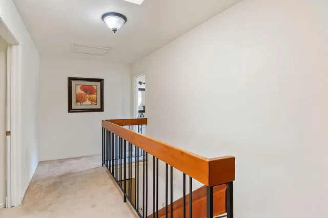 a view of staircase with wooden floor