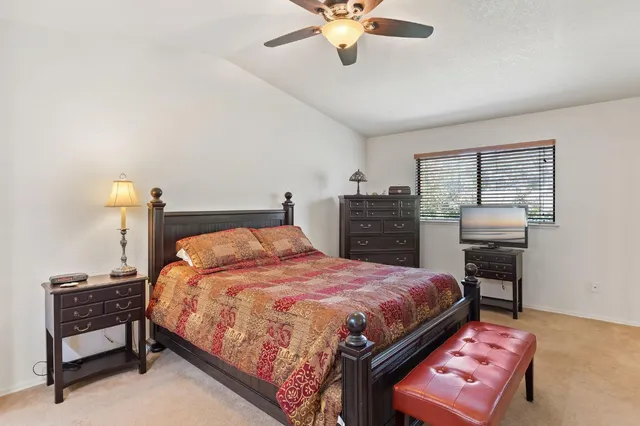 a bedroom with a bed and dresser