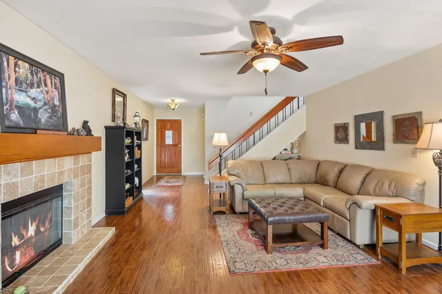 a living room with furniture and a fireplace