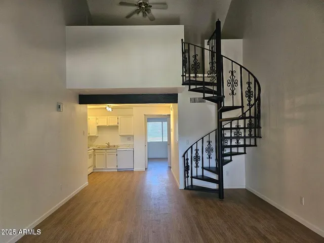 a view of entryway with wooden floor