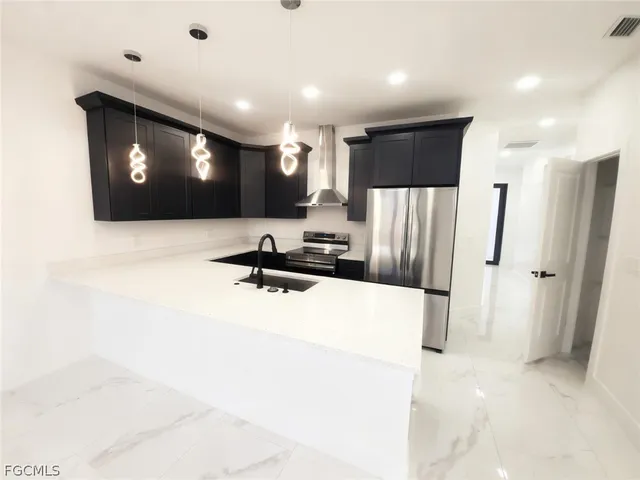 a view of a living room with a projector and refrigerator