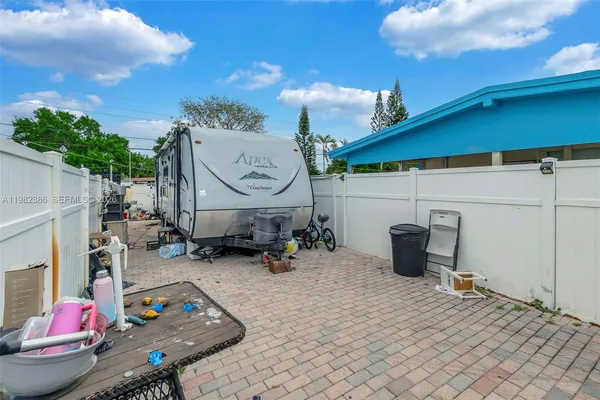 a view of a chairs and tables in patio