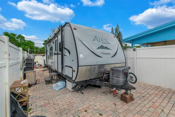 a view of a backyard with a sitting area and furniture