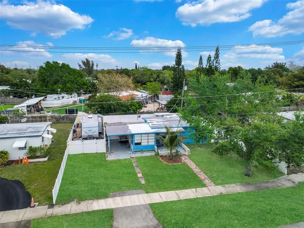 a view of a garden with houses