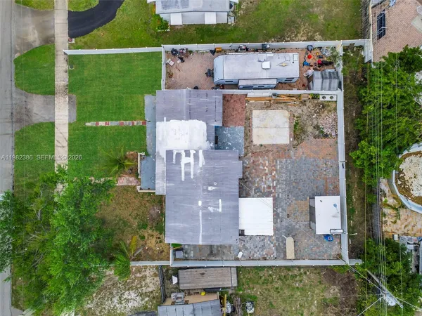 an aerial view of a house with a garden