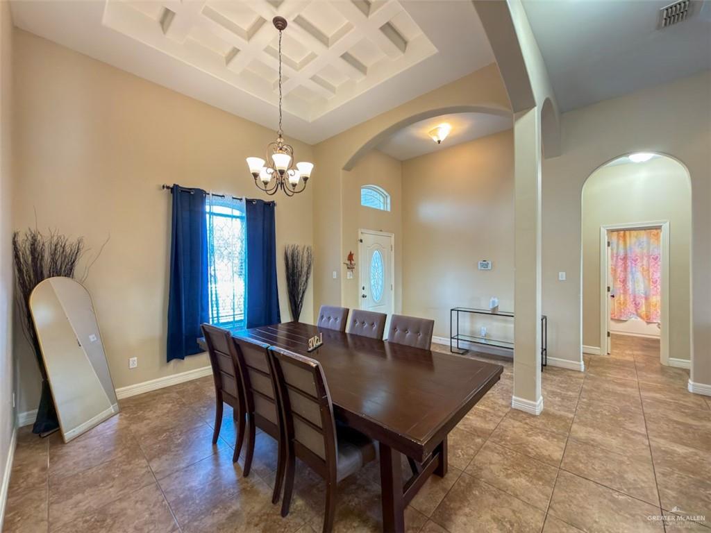 208 North 15th Street Hidalgo, TX 78557 - Photo 9 of 26 a view of a dining room with furniture and chandelier