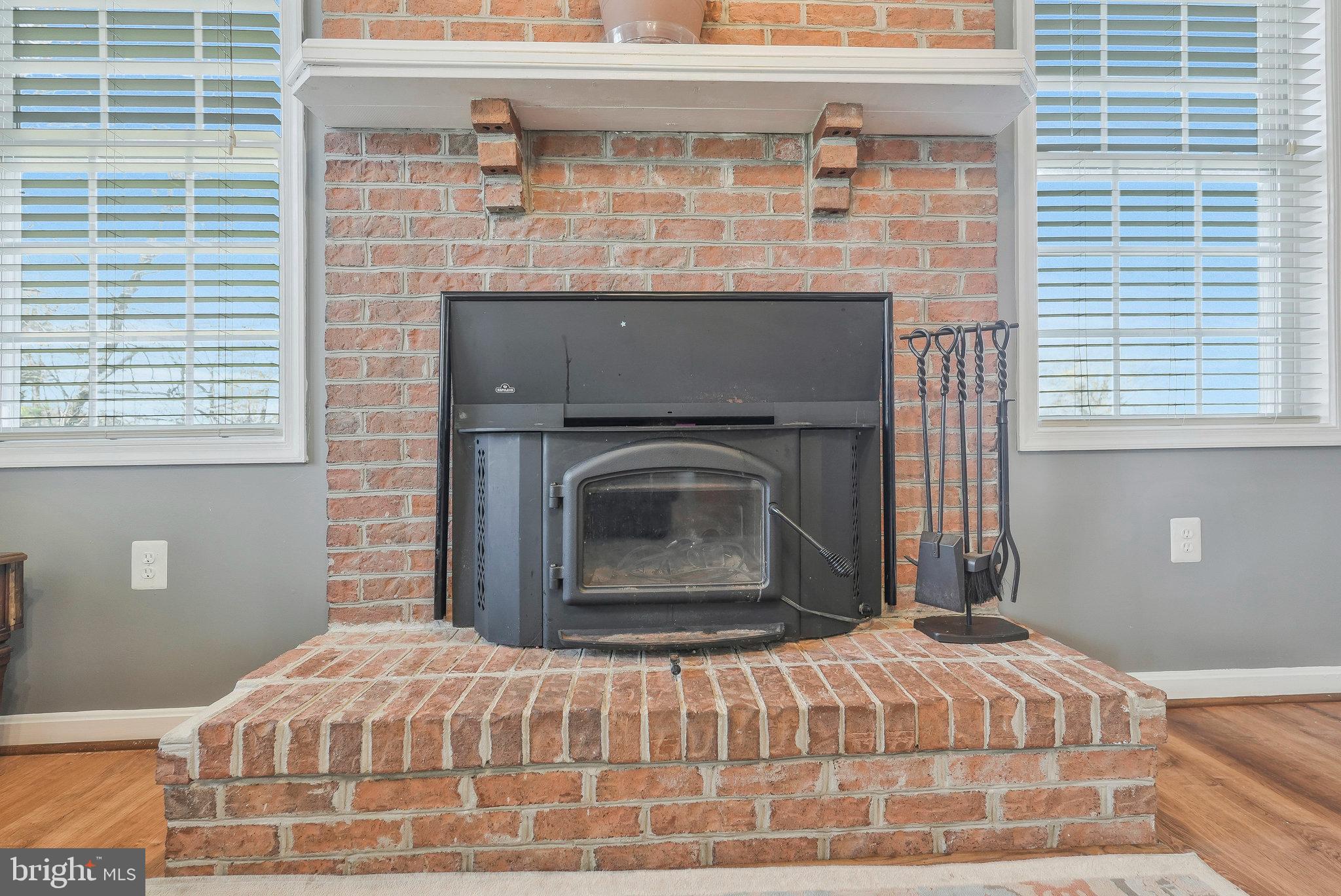 12433 Sub-Station Road Waldorf, MD 20601 - Photo 17 of 52 Raised Hearth Brick FP & Brick Chimney w/woodstove