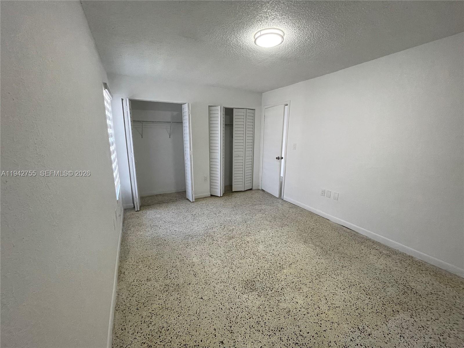 142 Southwest 18th Avenue, Unit 19 Miami, FL 33135 - Photo 11 of 28 an empty room with a natural light