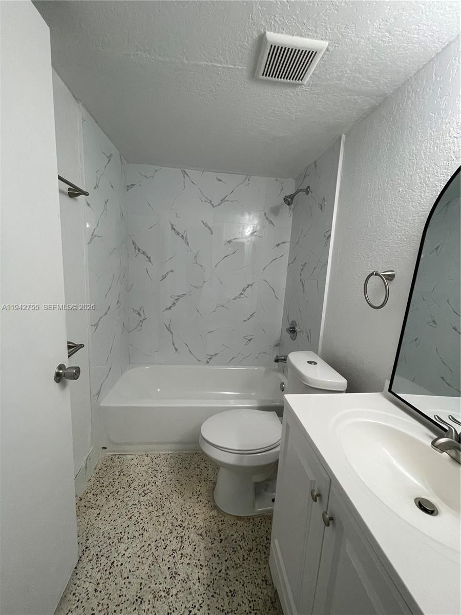 142 Southwest 18th Avenue, Unit 19 Miami, FL 33135 - Photo 15 of 28 a bathroom with a sink toilet and shower