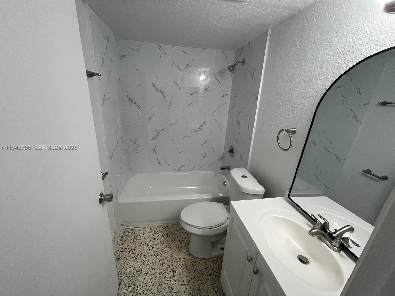 142 Southwest 18th Avenue, Unit 19 Miami, FL 33135 - Photo 16 of 28 a bathroom with a sink toilet and shower