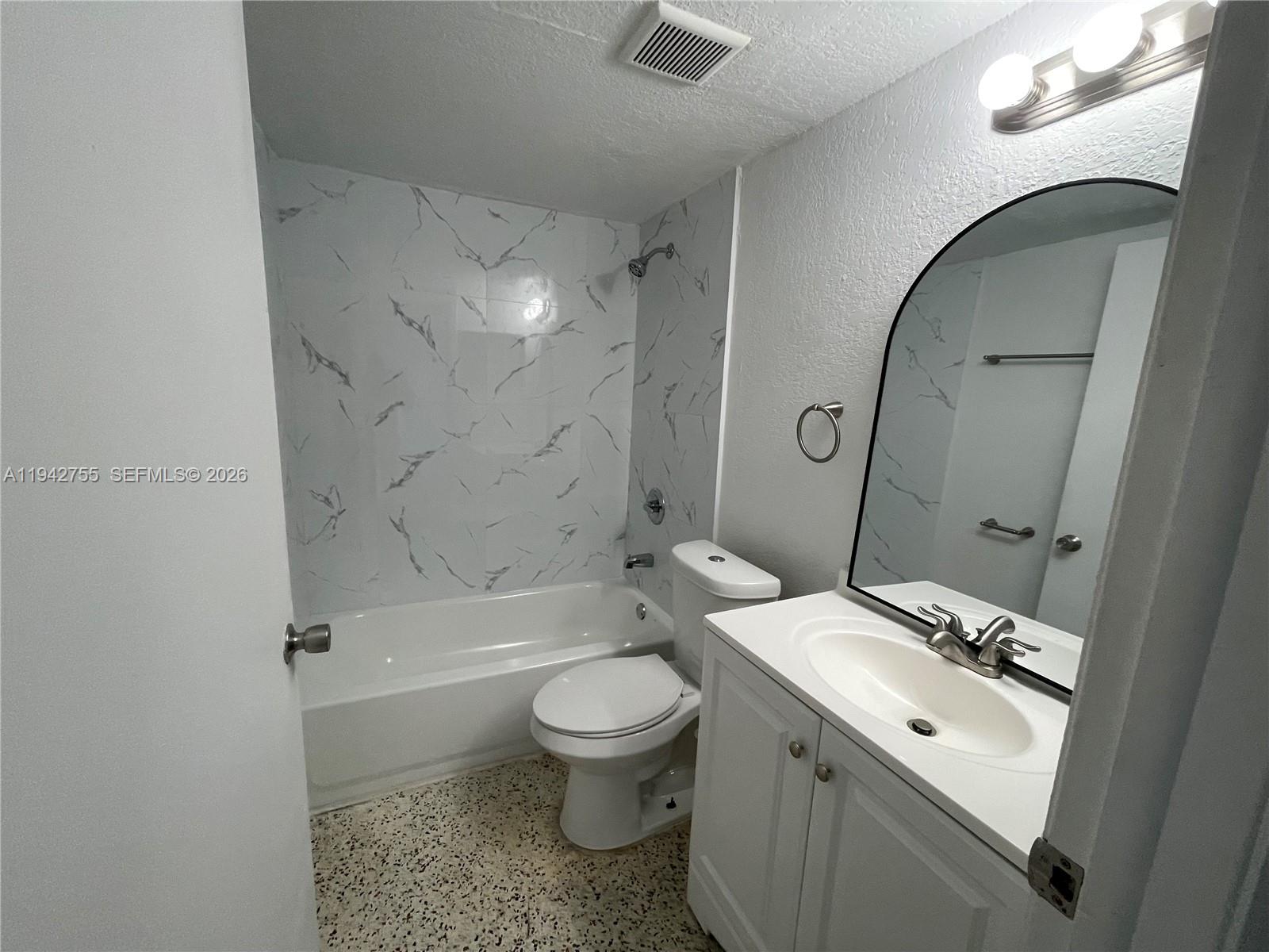 142 Southwest 18th Avenue, Unit 19 Miami, FL 33135 - Photo 17 of 28 a bathroom with a toilet a sink and bathtub