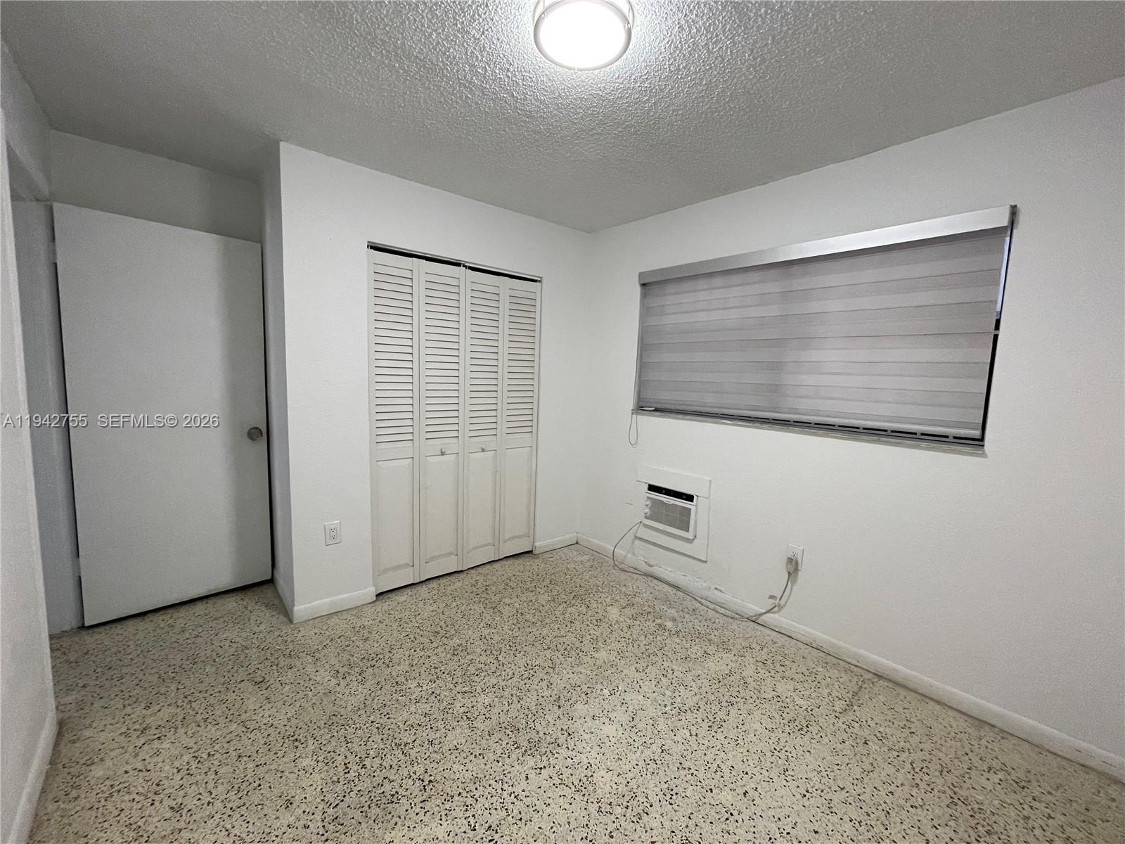 142 Southwest 18th Avenue, Unit 19 Miami, FL 33135 - Photo 22 of 28 a view of an empty room with closet area