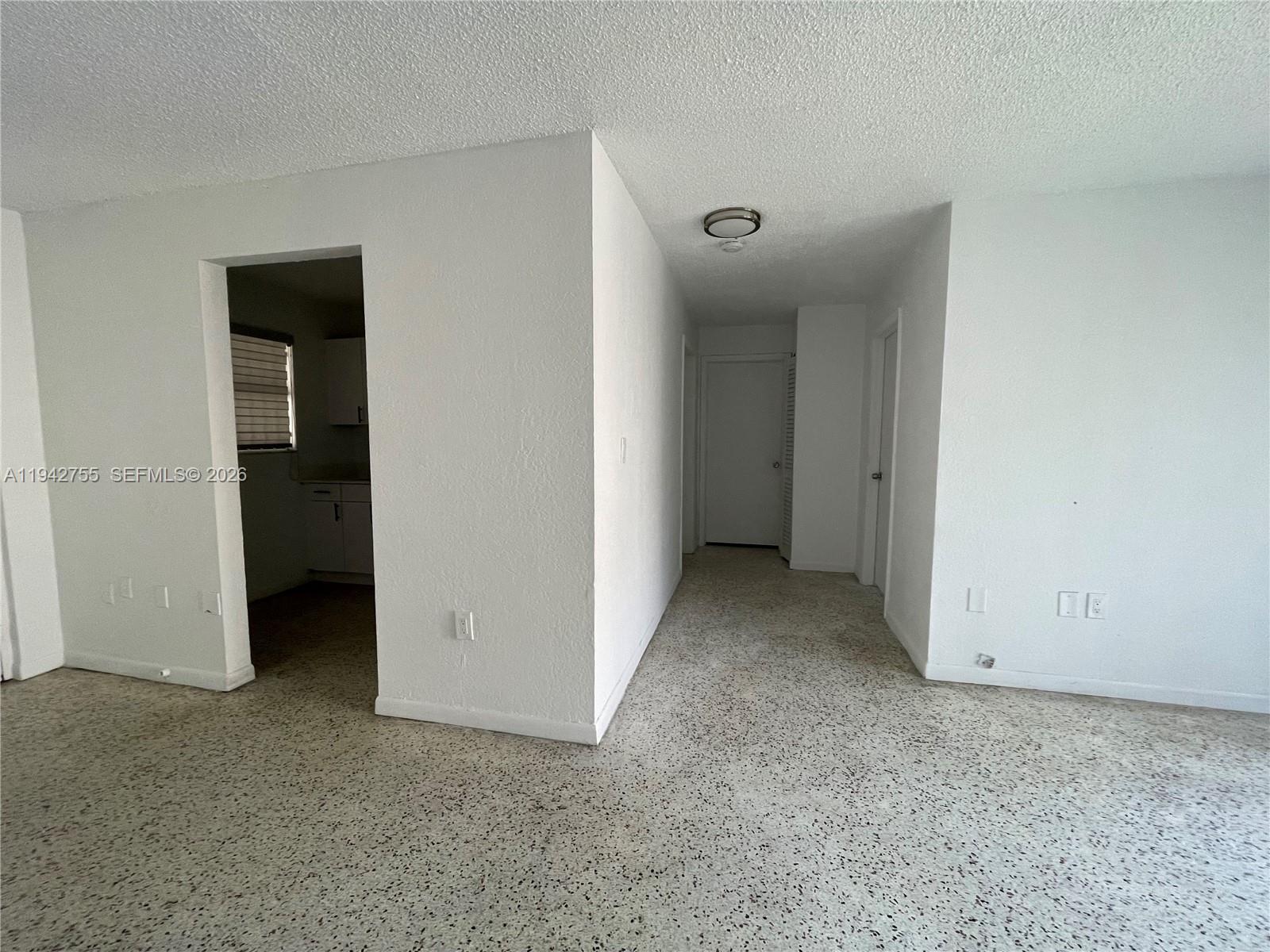 142 Southwest 18th Avenue, Unit 19 Miami, FL 33135 - Photo 24 of 28 an empty room with closet