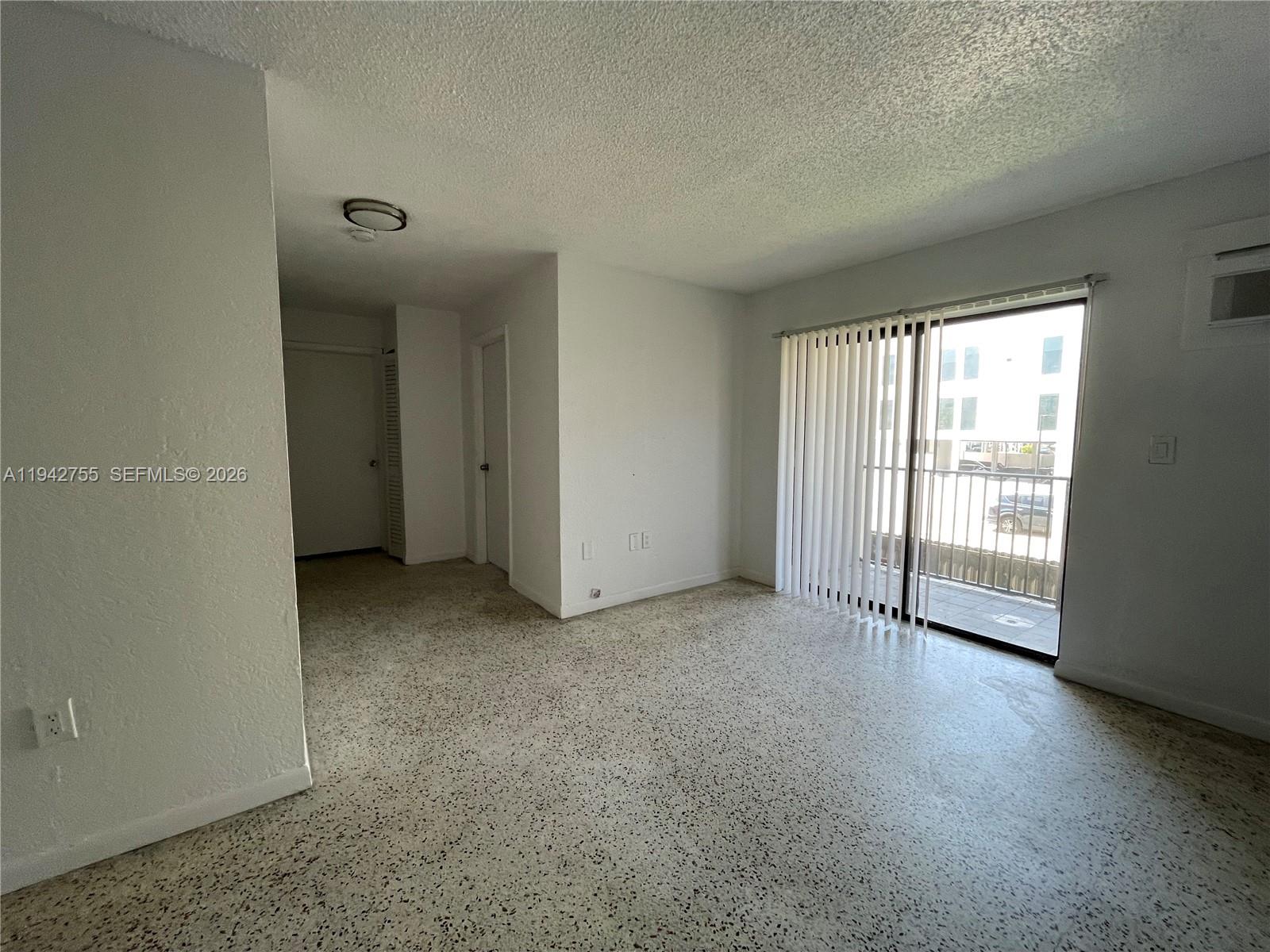 142 Southwest 18th Avenue, Unit 19 Miami, FL 33135 - Photo 26 of 28 an empty room with windows