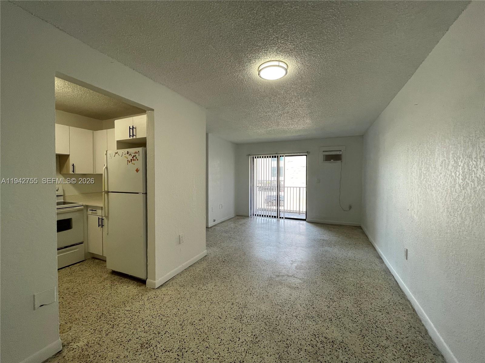 142 Southwest 18th Avenue, Unit 19 Miami, FL 33135 - Photo 27 of 28 a view of empty room with white walls and window