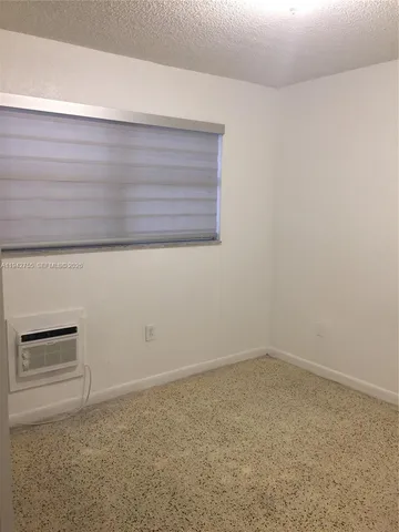 a view of empty room with windows