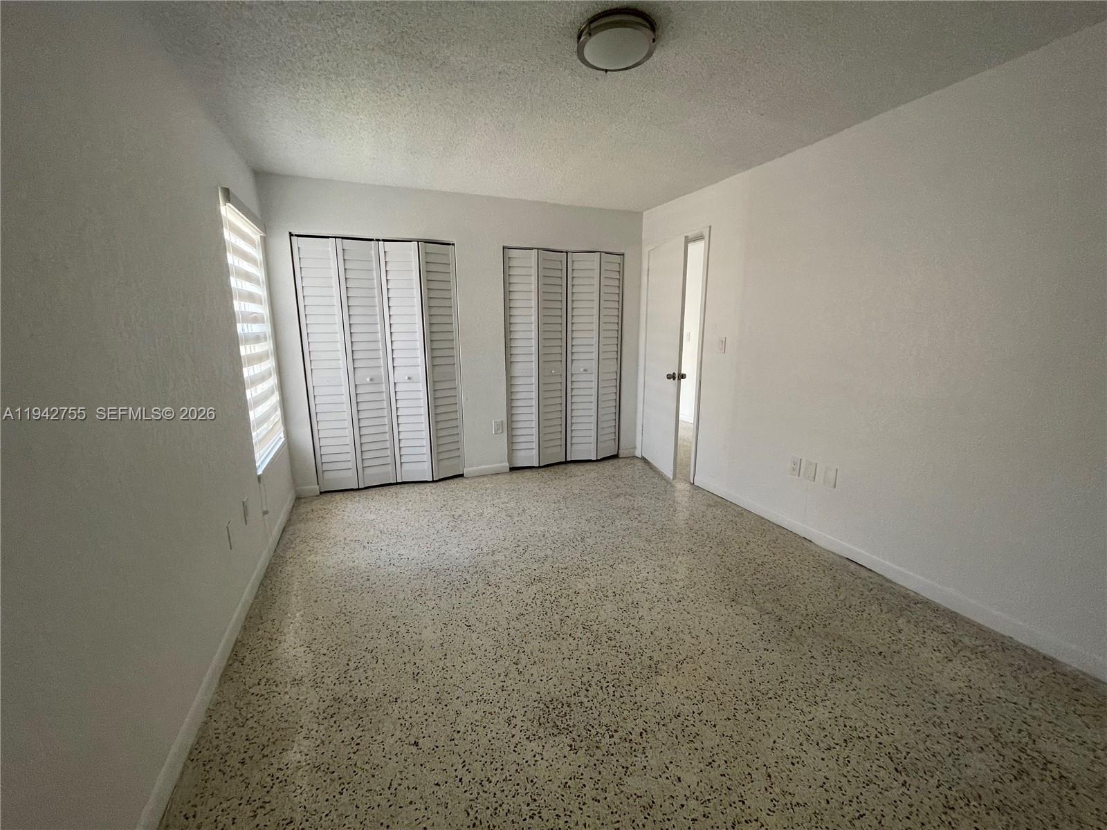 142 Southwest 18th Avenue, Unit 19 Miami, FL 33135 - Photo 9 of 28 an empty room with windows