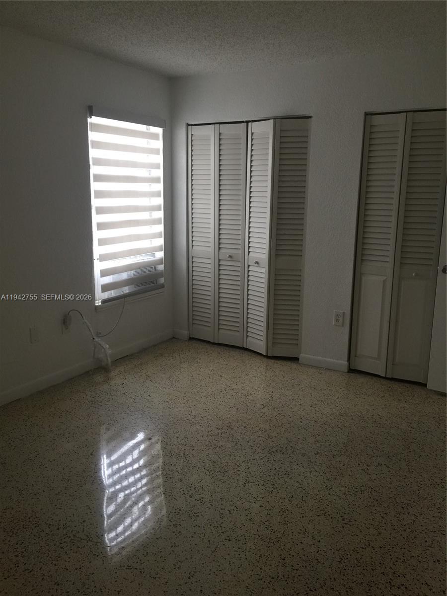 142 Southwest 18th Avenue, Unit 19 Miami, FL 33135 - Photo 10 of 11 a view of empty room with windows
