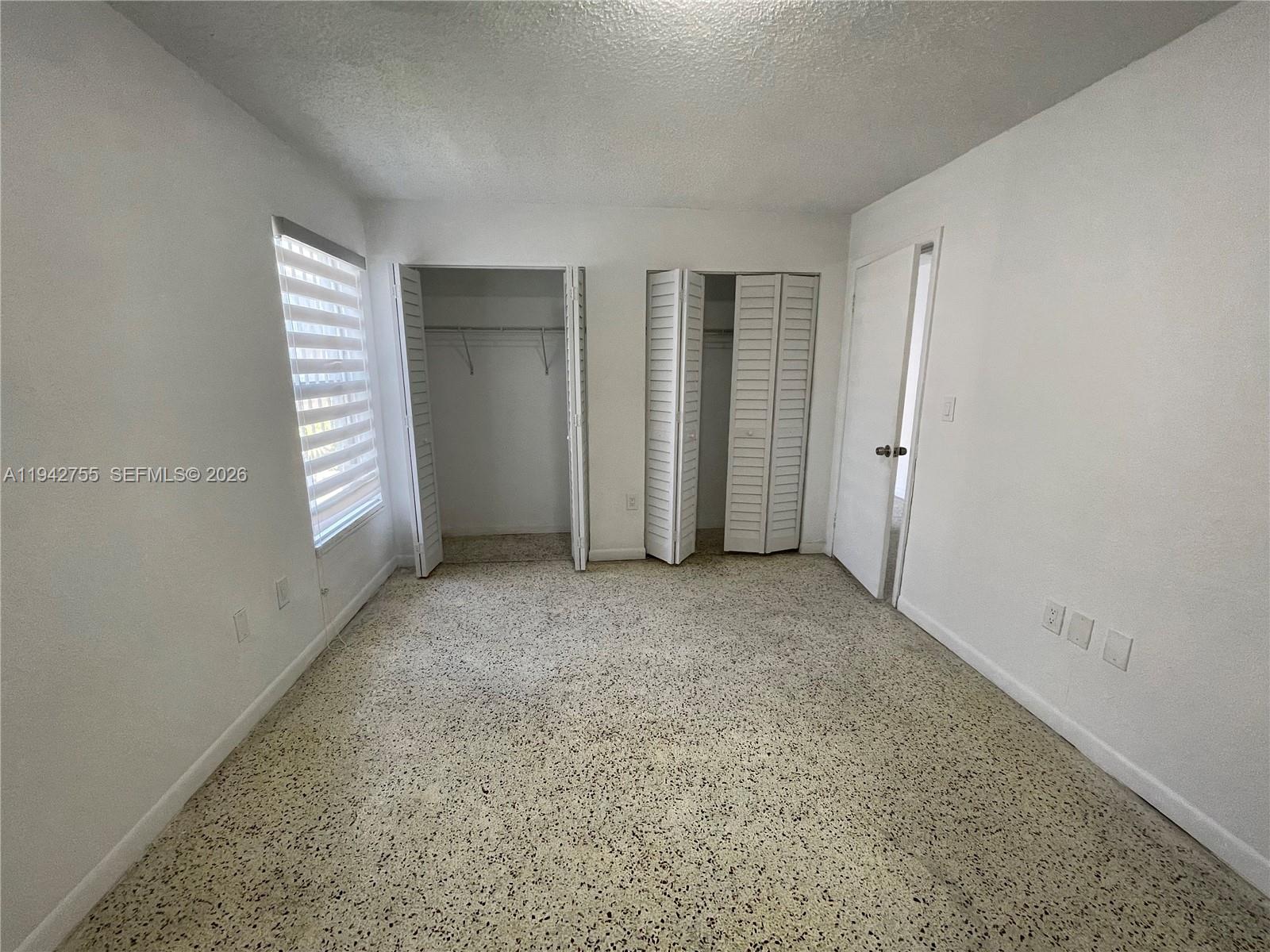 142 Southwest 18th Avenue, Unit 19 Miami, FL 33135 - Photo 10 of 28 an empty room with windows