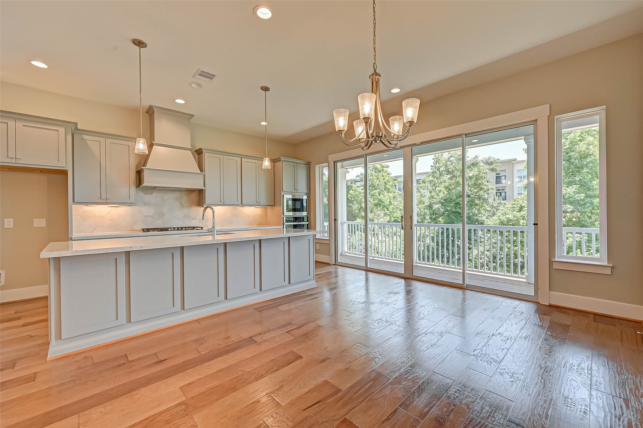 67 Thorpe Lane Spring, TX 77389 - Photo 2 of 27 a view of a kitchen with a sink and wooden floor