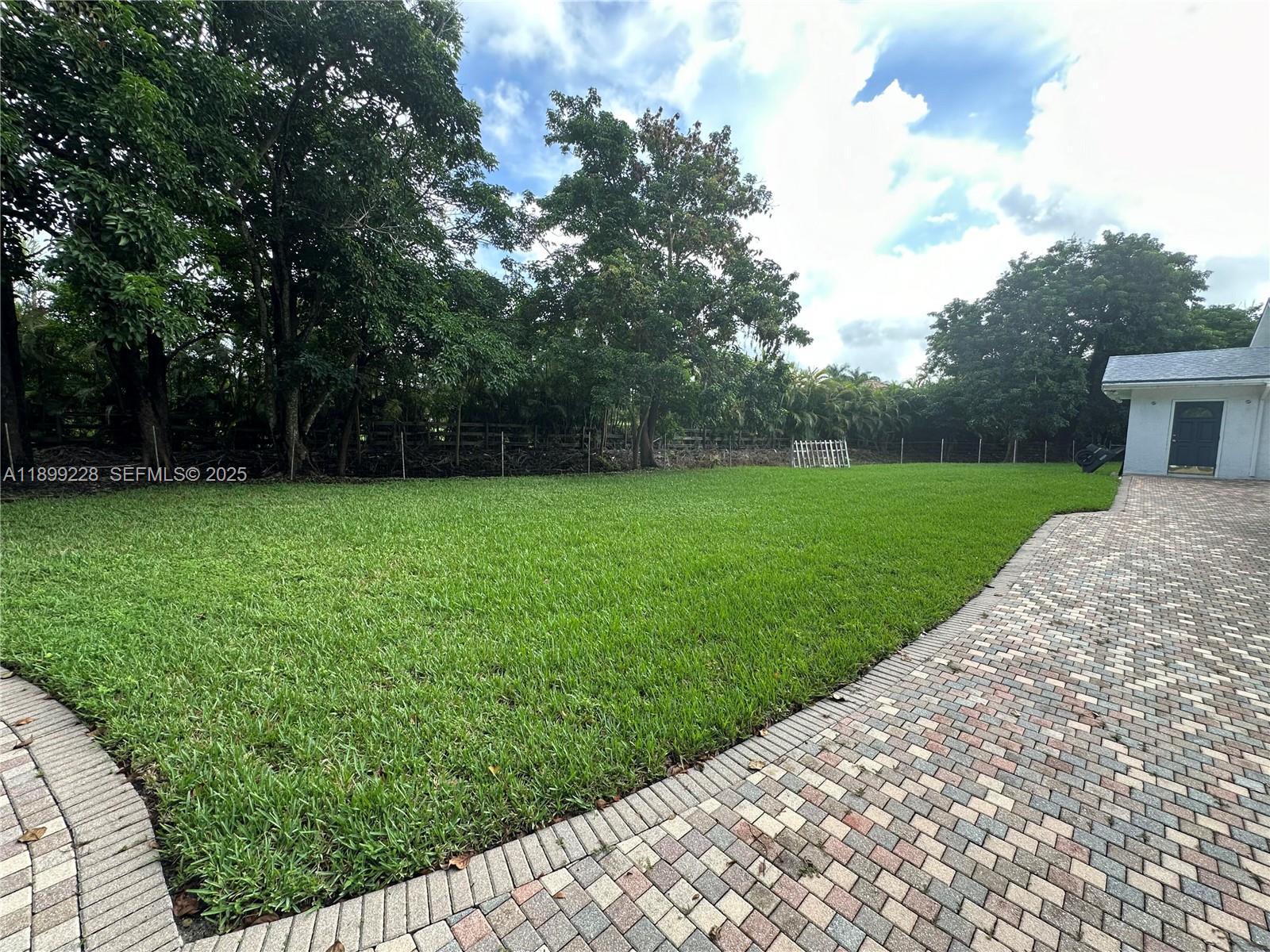 6300 Southwest 181st Lane Southwest Ranches, FL 33331 - Photo 12 of 20 a view of a backyard with a garden