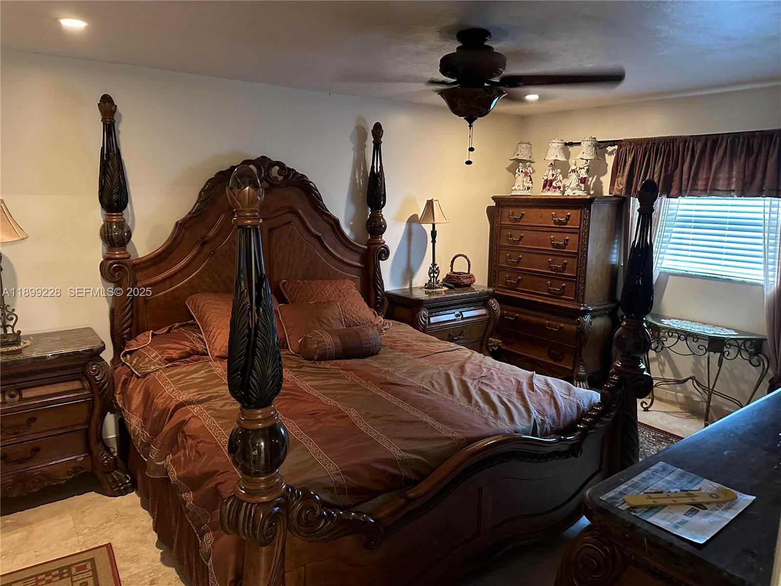 6300 Southwest 181st Lane Southwest Ranches, FL 33331 - Photo 13 of 20 a bed room with a bed and a ceiling fan