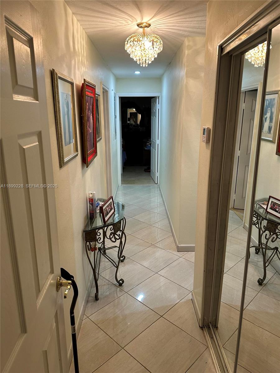 6300 Southwest 181st Lane Southwest Ranches, FL 33331 - Photo 14 of 20 a view of a hallway with workspace