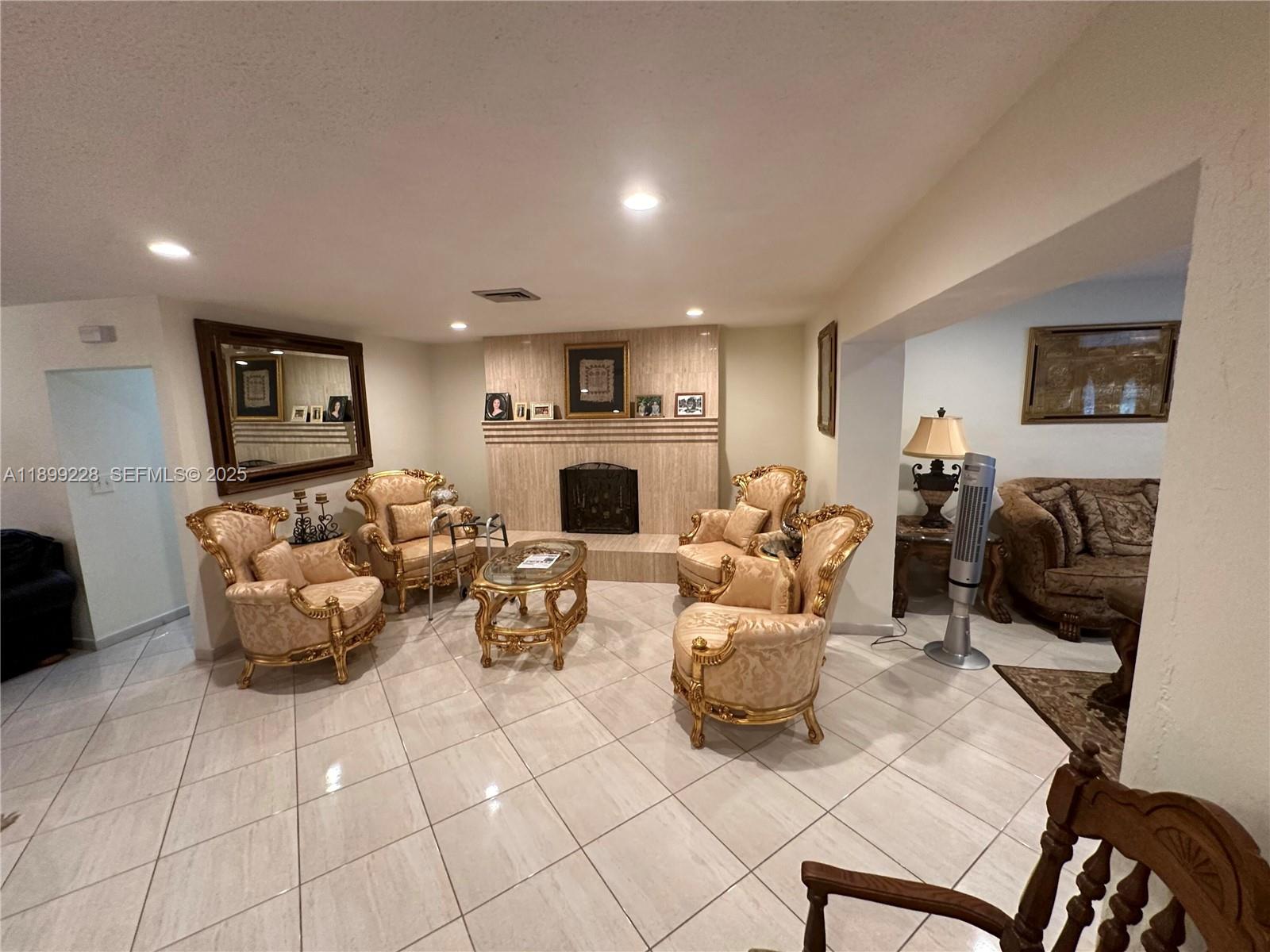 6300 Southwest 181st Lane Southwest Ranches, FL 33331 - Photo 18 of 20 a living room with furniture and a fireplace