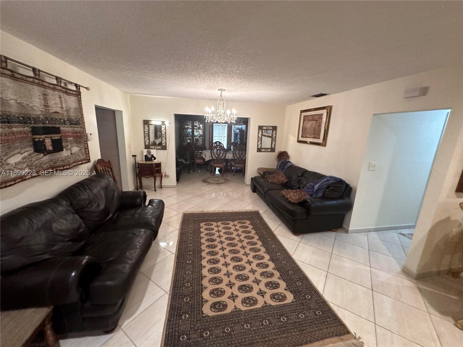 6300 Southwest 181st Lane Southwest Ranches, FL 33331 - Photo 19 of 20 a living room with furniture and a rug