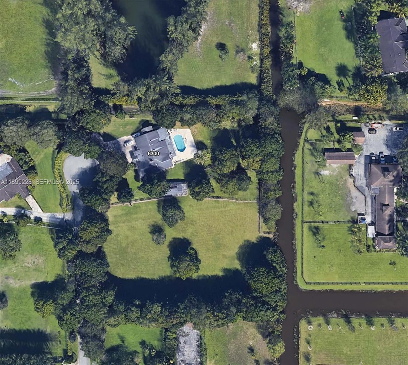 6300 Southwest 181st Lane Southwest Ranches, FL 33331 - Photo 5 of 20 an aerial view of residential houses with outdoor space