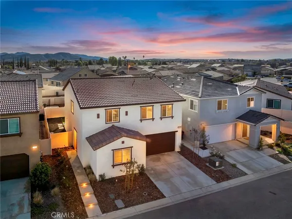 an aerial view of a house with a big yard