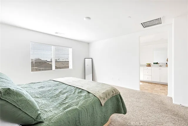 a bedroom with a bed and with furniture