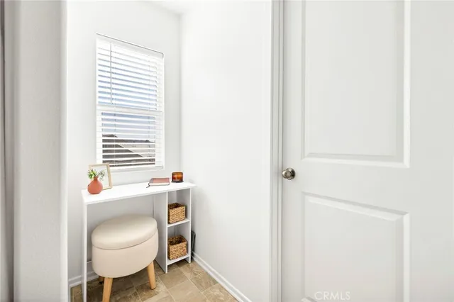 a room with a chair and a window