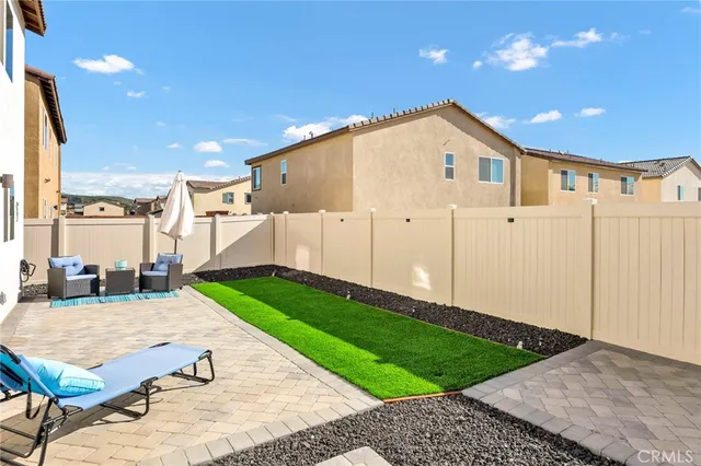 a view of a backyard of the house