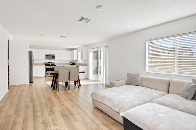 a living room with furniture and a table