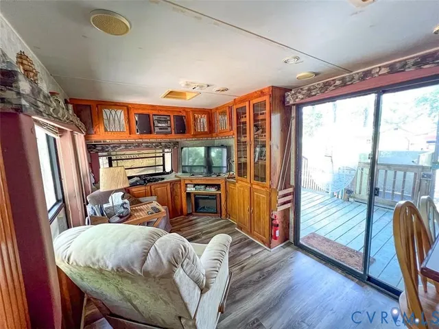 a living room with furniture and a floor to ceiling window