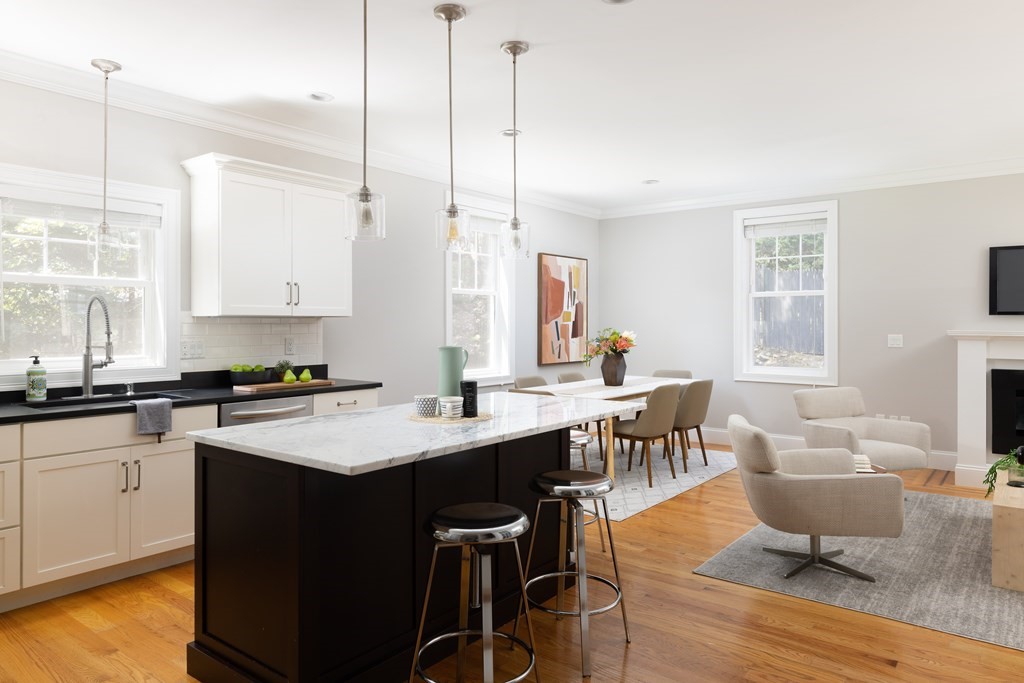 9 Hazel Terrace Arlington, MA 02474 - Photo 12 of 36 a kitchen with a sink a stove a dining table and chairs
