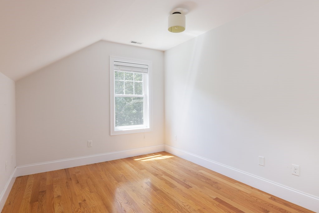 9 Hazel Terrace Arlington, MA 02474 - Photo 22 of 36 an empty room with a window