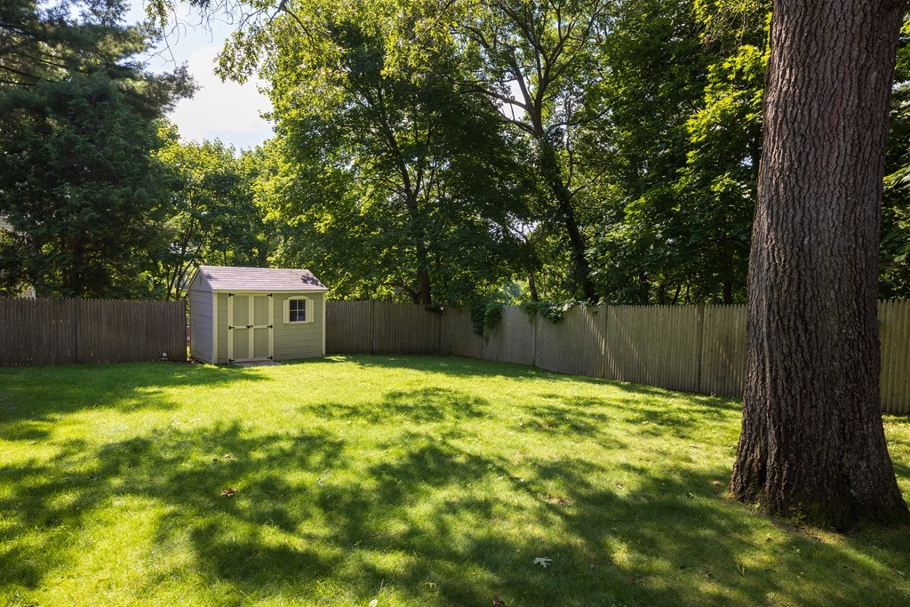 9 Hazel Terrace Arlington, MA 02474 - Photo 30 of 36 a swimming pool with wooden fence