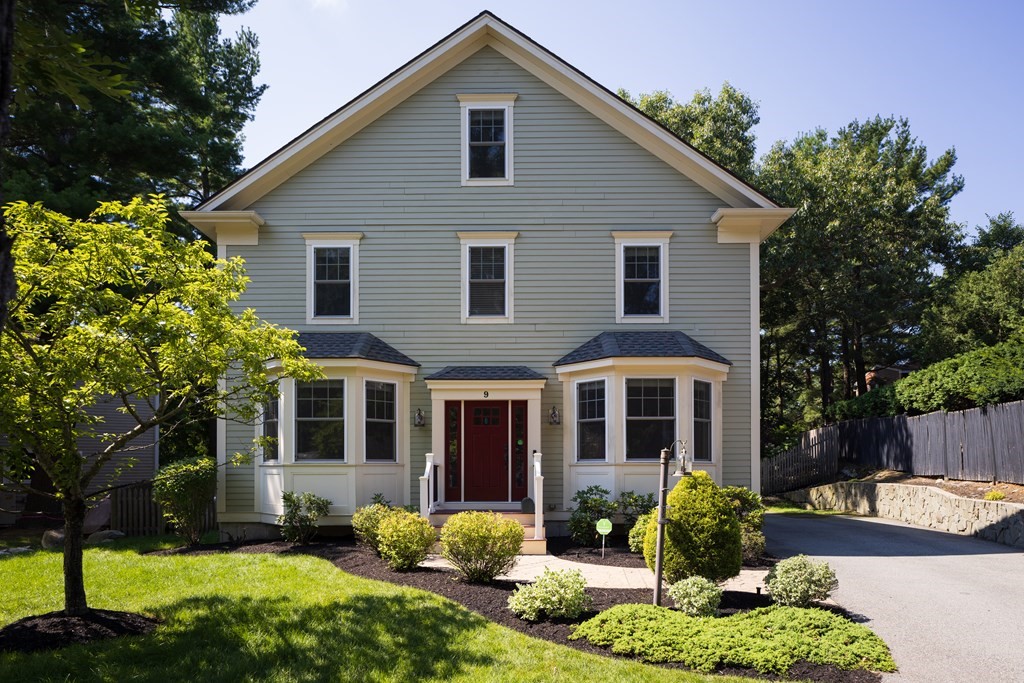 9 Hazel Terrace Arlington, MA 02474 - Photo 34 of 36 a front view of a house with a yard and potted plants