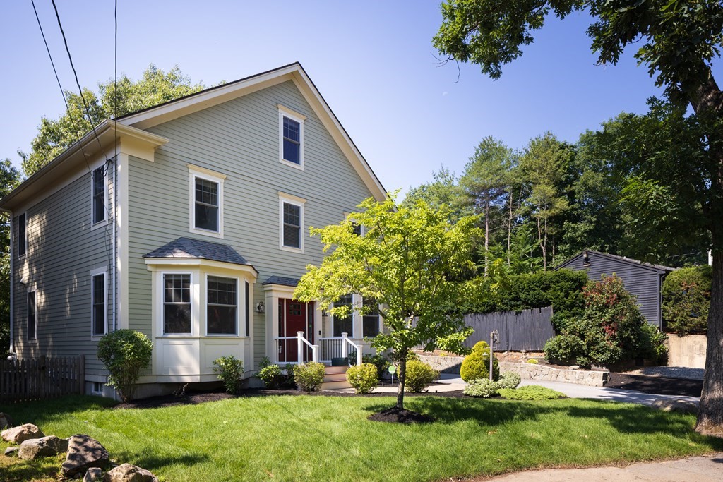 9 Hazel Terrace Arlington, MA 02474 - Photo 35 of 36 a front view of a house with a yard and outdoor seating