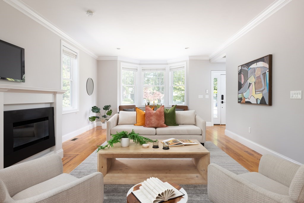 9 Hazel Terrace Arlington, MA 02474 - Photo 10 of 36 a living room with furniture fireplace and a flat screen tv