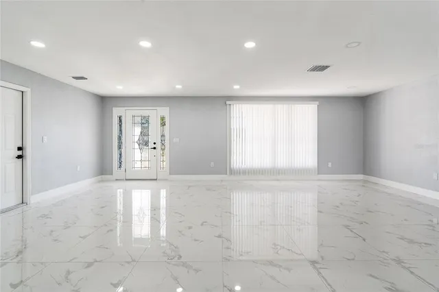 a view of an empty room with a window