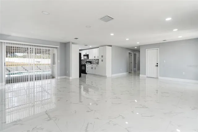 a view of a livingroom with a staircase